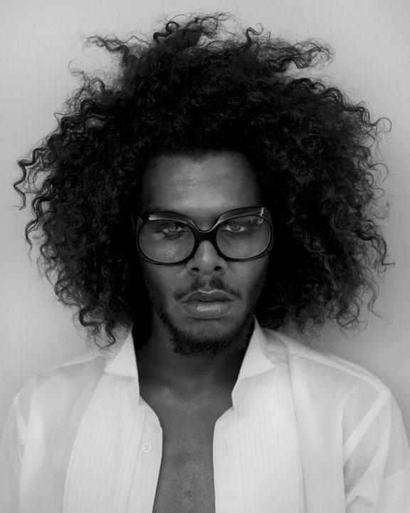 model timothy clark with his curly kinky afro style hair